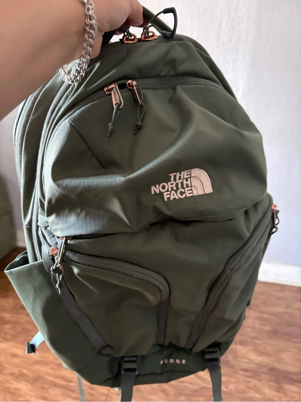 The North Face Olive Green Backpack with Rose Gold Accents